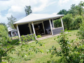 Cozy tentlodge with roofed terrace in a green area